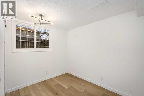 15 A Arlington Bay Se, Calgary, AB - Indoor Photo Showing Other Room