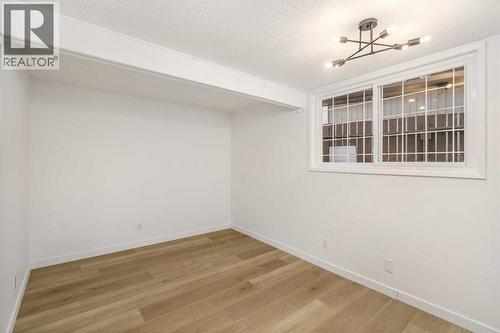 15 A Arlington Bay Se, Calgary, AB - Indoor Photo Showing Other Room