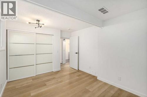 15 A Arlington Bay Se, Calgary, AB - Indoor Photo Showing Other Room