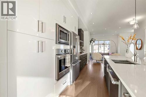 Lots of Cupboard & Storage Space + a Built-in Wall Oven & Microwave - 303 30 Avenue Ne, Calgary, AB - Indoor Photo Showing Kitchen With Double Sink With Upgraded Kitchen