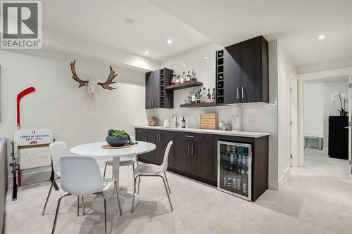 Wet Bar W/ Beverage Fridge - 303 30 Avenue Ne, Calgary, AB - Indoor Photo Showing Dining Room