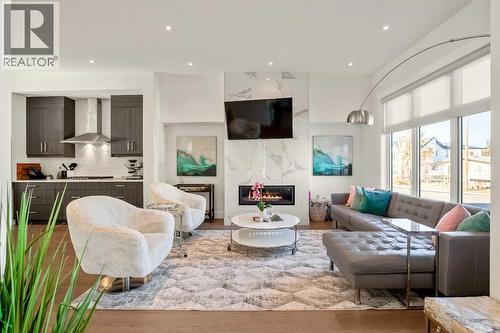 Awesome Living Room Space W/ Large Gas Fireplace - 303 30 Avenue Ne, Calgary, AB - Indoor Photo Showing Living Room With Fireplace