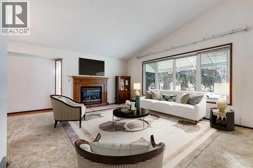 3387 Breton Close Nw, Calgary, AB - Indoor Photo Showing Living Room With Fireplace