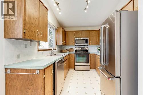 3387 Breton Close Nw, Calgary, AB - Indoor Photo Showing Kitchen With Stainless Steel Kitchen With Double Sink