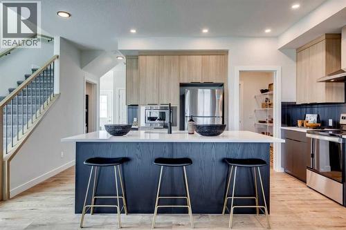 149 Southbow Drive, Cochrane, AB - Indoor Photo Showing Kitchen With Upgraded Kitchen