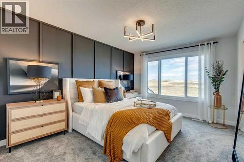 149 Southbow Drive, Cochrane, AB - Indoor Photo Showing Bedroom