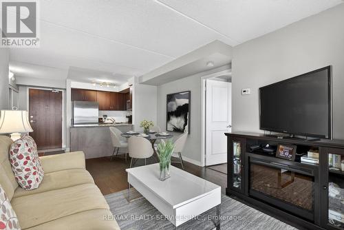 Virtually staged dining room option - 315 - 50 Via Rosedale Way, Brampton, ON - Indoor Photo Showing Living Room