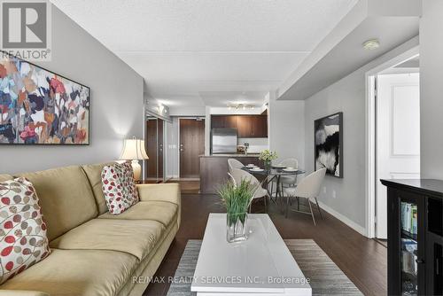 Virtually staged dining room option - 315 - 50 Via Rosedale Way, Brampton, ON - Indoor Photo Showing Living Room