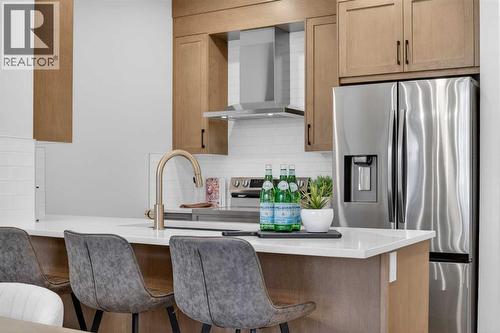 1051 Bayview Crescent, Airdrie, AB - Indoor Photo Showing Kitchen With Stainless Steel Kitchen With Upgraded Kitchen