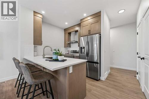 1051 Bayview Crescent, Airdrie, AB - Indoor Photo Showing Kitchen With Stainless Steel Kitchen