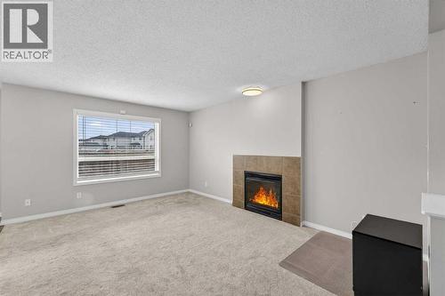 23 Taralake Lane Ne, Calgary, AB - Indoor Photo Showing Living Room With Fireplace