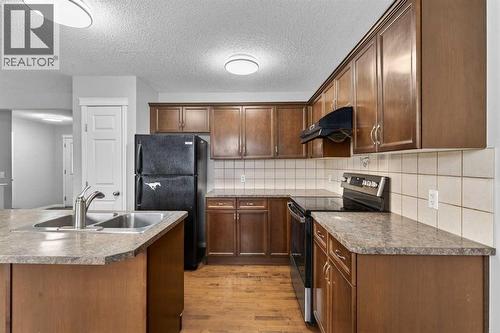 23 Taralake Lane Ne, Calgary, AB - Indoor Photo Showing Kitchen With Double Sink