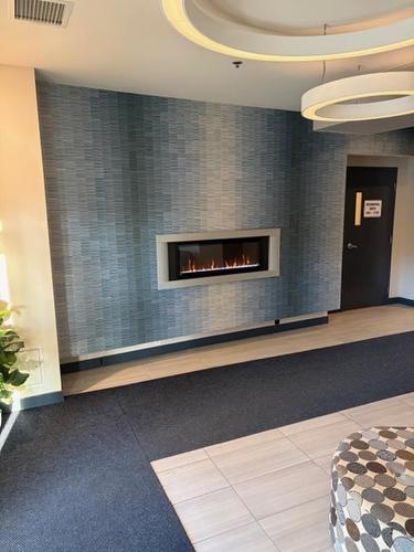 2103 2260 Sleeping Giant Parkway, Thunder Bay, ON - Indoor Photo Showing Other Room With Fireplace