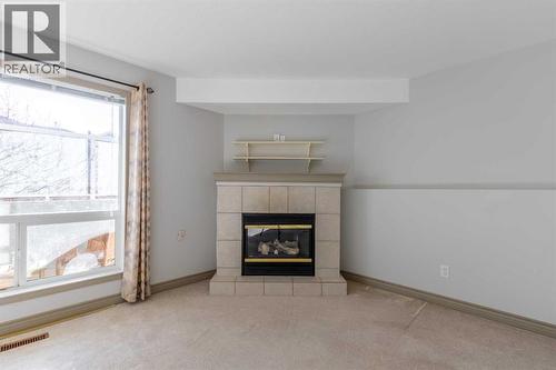 314, 23 Chilcotin Lane W, Lethbridge, AB - Indoor With Fireplace