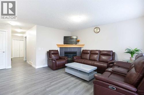138 Saddlecrest Way Ne, Calgary, AB - Indoor Photo Showing Living Room With Fireplace