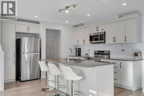 4 Southwinds Gate Sw, Airdrie, AB - Indoor Photo Showing Kitchen With Stainless Steel Kitchen With Upgraded Kitchen