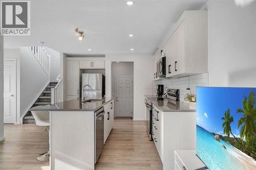 4 Southwinds Gate Sw, Airdrie, AB - Indoor Photo Showing Kitchen With Stainless Steel Kitchen With Upgraded Kitchen