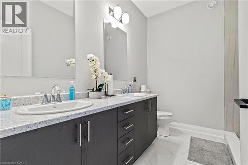 Full bathroom with double vanity and a shower - 24 Tamarack Way, Simcoe, ON - Indoor Photo Showing Bathroom