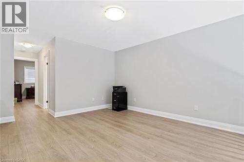 Empty room featuring baseboards and light wood finished floors - 24 Tamarack Way, Simcoe, ON - Indoor Photo Showing Other Room