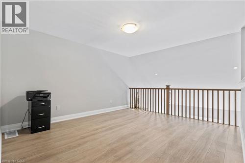 Empty room with light wood-type flooring and baseboards - 24 Tamarack Way, Simcoe, ON - Indoor Photo Showing Other Room