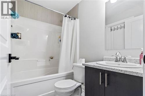 Bathroom with vanity and shower / bath combination with curtain - 24 Tamarack Way, Simcoe, ON - Indoor Photo Showing Bathroom