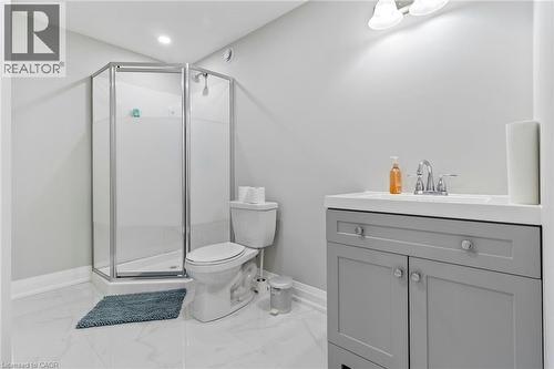 Full bathroom with a shower stall, vanity, and light marble finish flooring - 24 Tamarack Way, Simcoe, ON - Indoor Photo Showing Bathroom