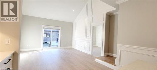 light wood-style flooring, ornamental molding, and recessed lighting - 24 Tamarack Way, Simcoe, ON - Indoor Photo Showing Other Room