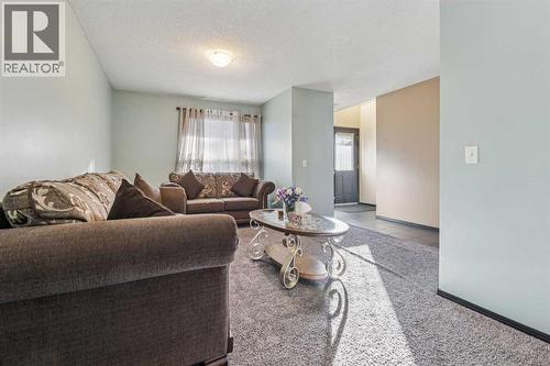 110 Eversyde Common Sw, Calgary, AB - Indoor Photo Showing Living Room