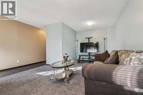 110 Eversyde Common Sw, Calgary, AB - Indoor Photo Showing Living Room