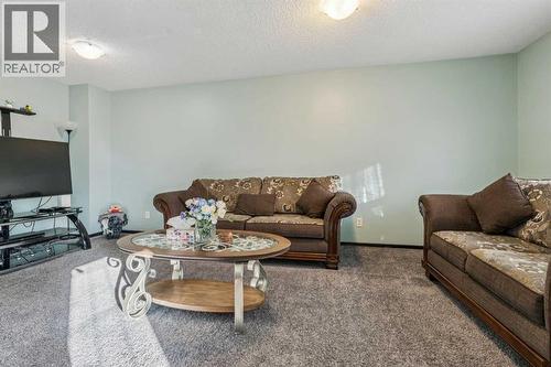 110 Eversyde Common Sw, Calgary, AB - Indoor Photo Showing Living Room