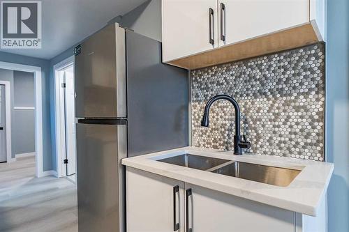 134 Erin Meadow Crescent Se, Calgary, AB - Indoor Photo Showing Kitchen With Double Sink