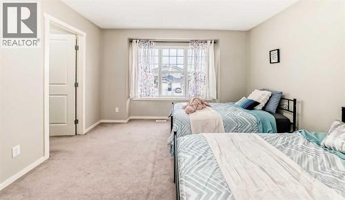 822 Panatella Boulevard Nw, Calgary, AB - Indoor Photo Showing Bedroom
