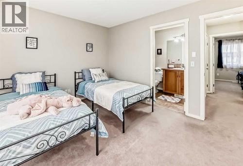 822 Panatella Boulevard Nw, Calgary, AB - Indoor Photo Showing Bedroom