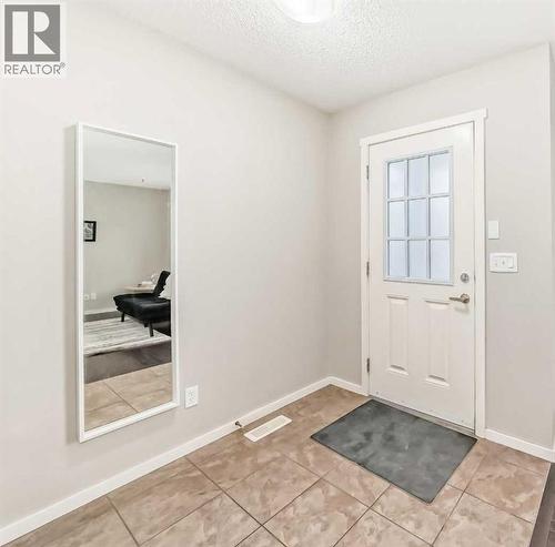 Front entrance area - 822 Panatella Boulevard Nw, Calgary, AB - Indoor Photo Showing Other Room