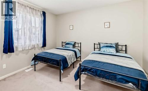 second master bedroom - 822 Panatella Boulevard Nw, Calgary, AB - Indoor Photo Showing Bedroom