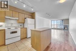 Kitchen Over-looking Dining and Living RM - 