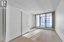 Primary Bedroom with glass door access to the Den - 