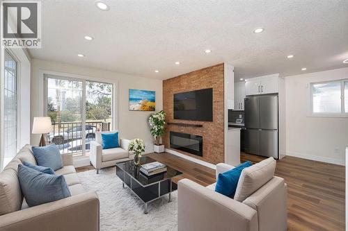 140 Whitworth Way, Calgary, AB - Indoor Photo Showing Living Room With Fireplace