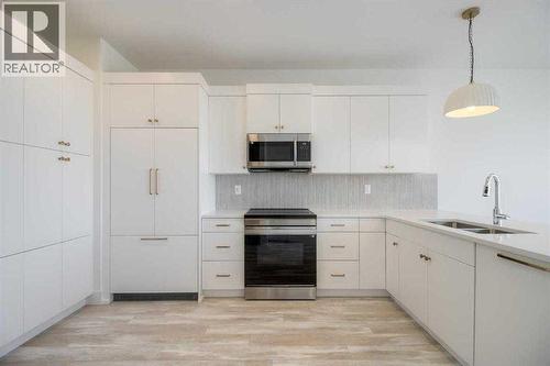 4333 28 Avenue S, Lethbridge, AB - Indoor Photo Showing Kitchen With Double Sink