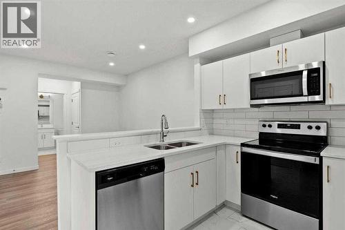 640 Masters Road Se, Calgary, AB - Indoor Photo Showing Kitchen With Double Sink