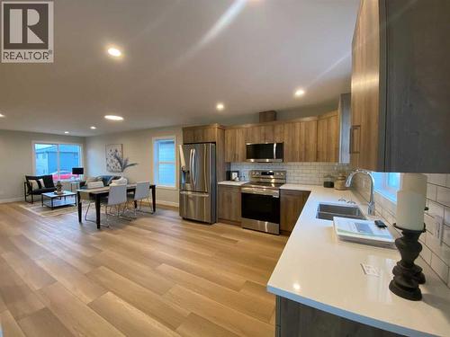 4213 57 Street, Taber, AB - Indoor Photo Showing Kitchen With Stainless Steel Kitchen With Double Sink