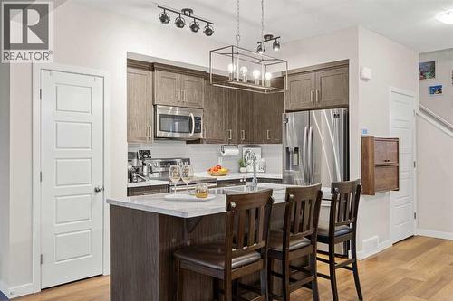 1027 Lanark Boulevard Se, Airdrie, AB - Indoor Photo Showing Kitchen With Stainless Steel Kitchen With Upgraded Kitchen