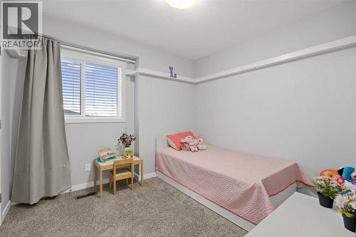 1027 Lanark Boulevard Se, Airdrie, AB - Indoor Photo Showing Bedroom