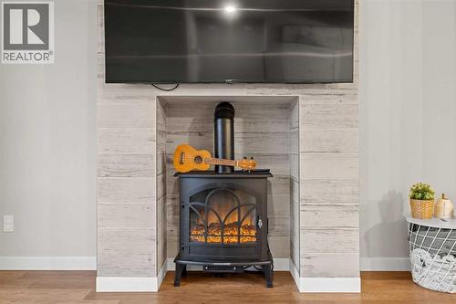 1027 Lanark Boulevard Se, Airdrie, AB - Indoor Photo Showing Other Room With Fireplace