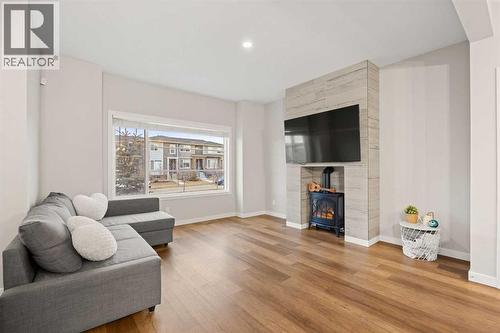 1027 Lanark Boulevard Se, Airdrie, AB - Indoor Photo Showing Living Room With Fireplace