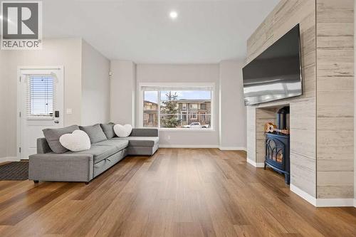 1027 Lanark Boulevard Se, Airdrie, AB - Indoor Photo Showing Living Room With Fireplace