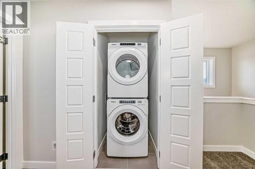 241 Bridgeport Gate, Chestermere, AB - Indoor Photo Showing Laundry Room