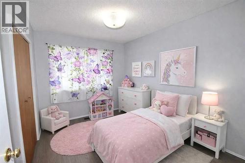 virtually staged - 97 Cunningham Crescent, Red Deer, AB - Indoor Photo Showing Bedroom