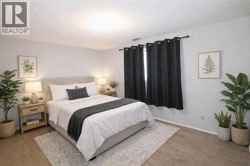 virtually staged - 97 Cunningham Crescent, Red Deer, AB - Indoor Photo Showing Bedroom