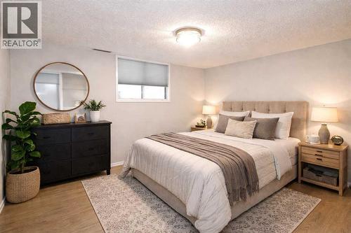 virtually staged - 97 Cunningham Crescent, Red Deer, AB - Indoor Photo Showing Bedroom
